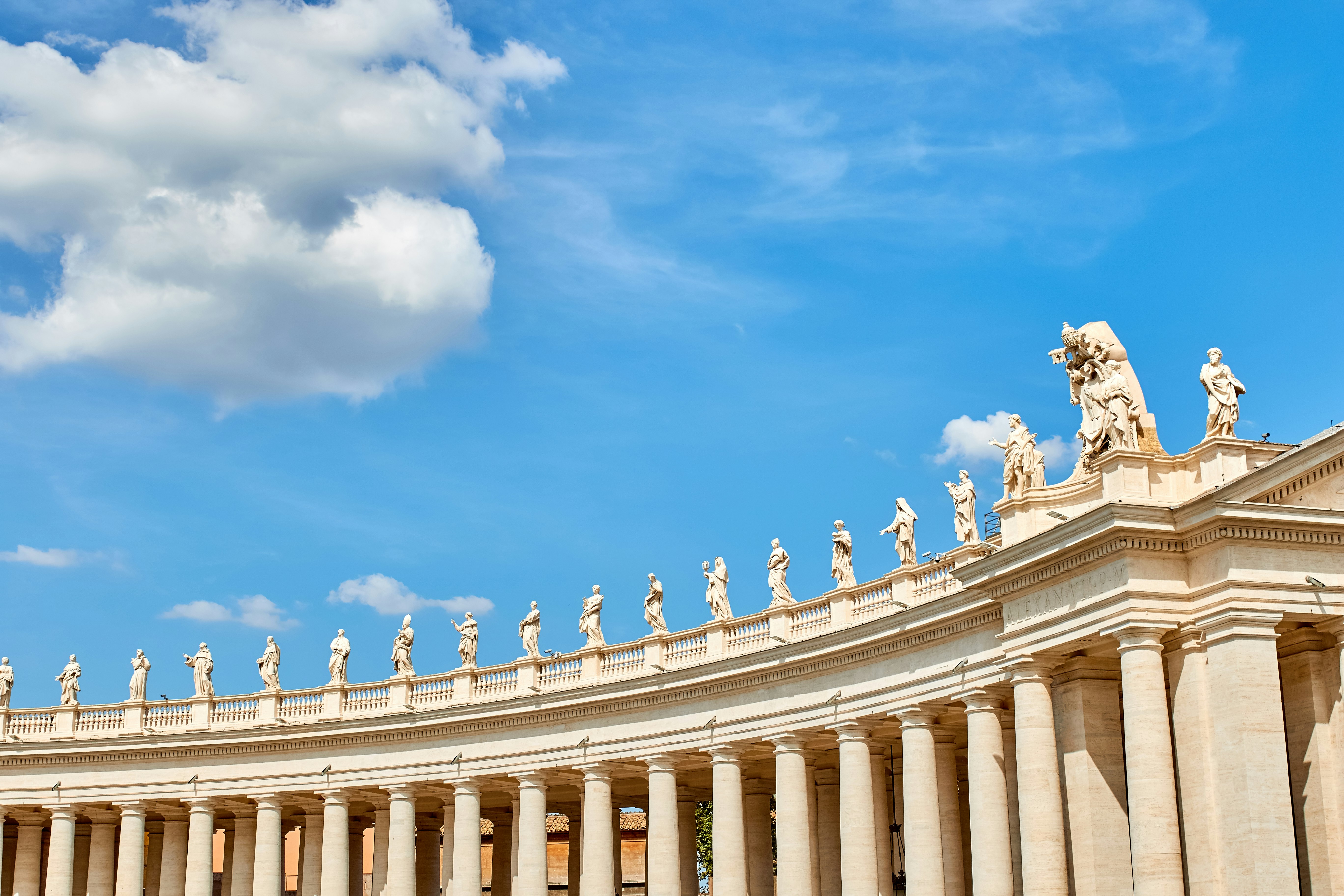 brown concrete palace under blue sky and white clouds